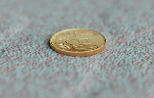 Coin with projected pattern